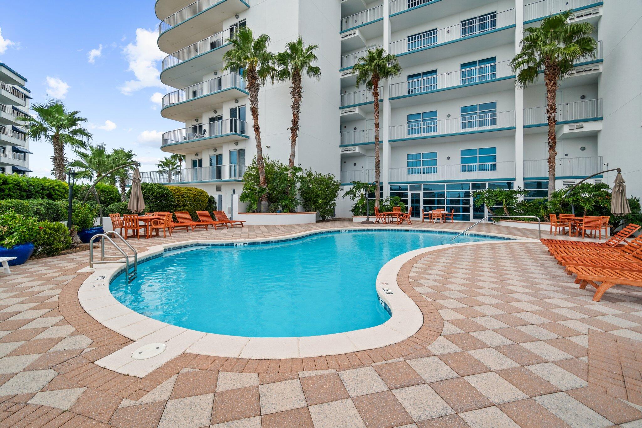 211 Durango Road, Unit 311 Destin, FL 32541 - Photo 68 of 71 a view of a swimming pool with a fountain in front of the house