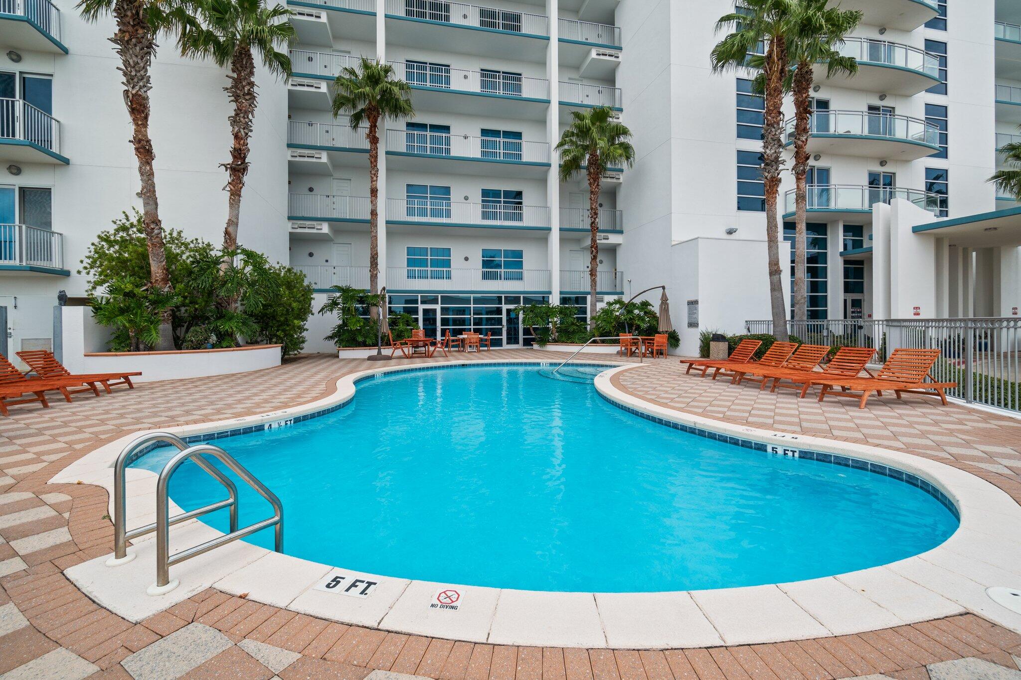 211 Durango Road, Unit 311 Destin, FL 32541 - Photo 69 of 71 a swimming pool with outdoor seating and yard