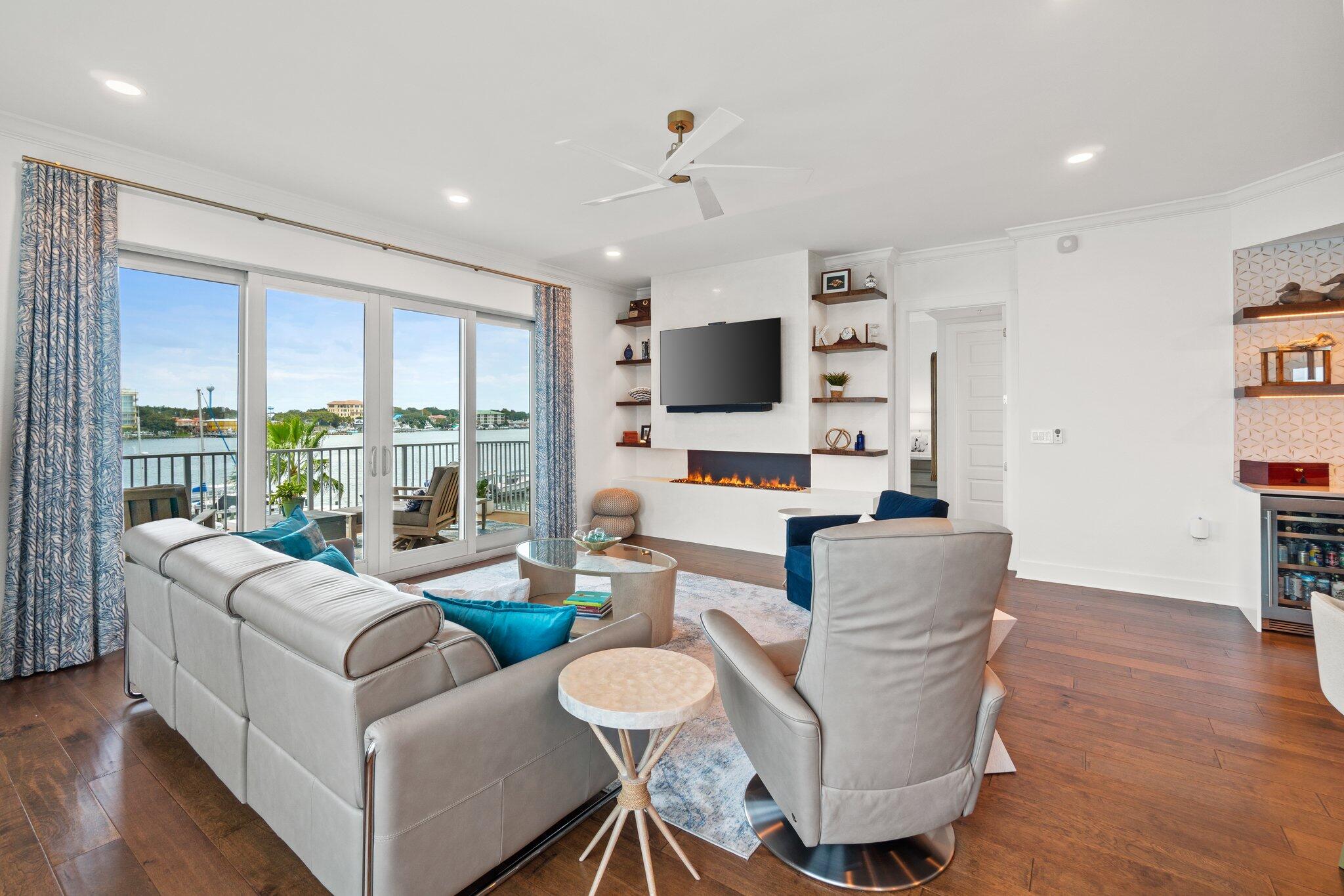 211 Durango Road, Unit 311 Destin, FL 32541 - Photo 9 of 71 a living room with fireplace furniture and a flat screen tv