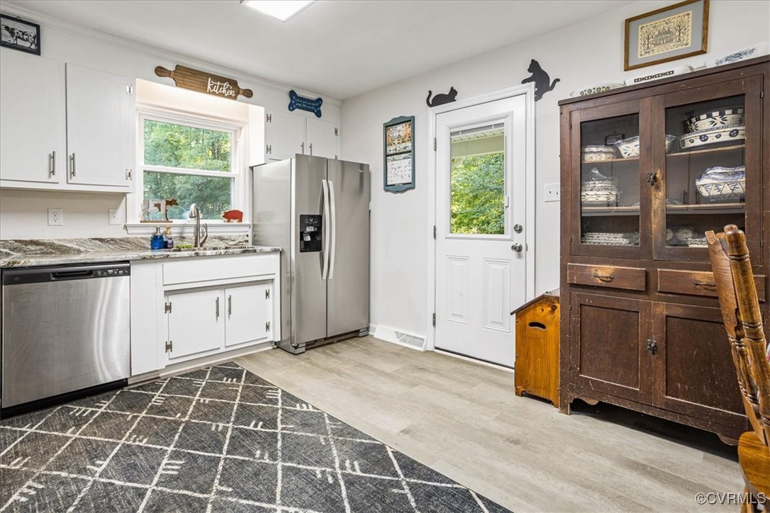 6314 Heritage Road Prince George, VA 23875 - Photo 12 of 26 Kitchen with light wood-type flooring, white cabin