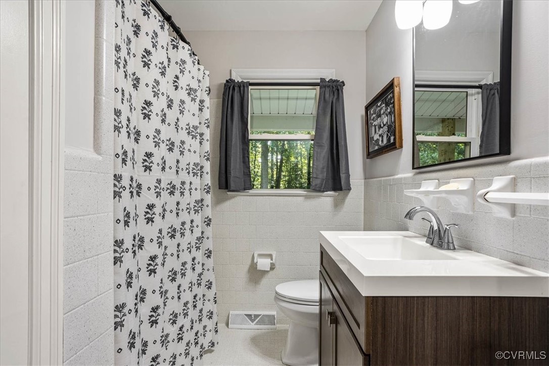 6314 Heritage Road Prince George, VA 23875 - Photo 14 of 26 Bathroom featuring a wealth of natural light, vani