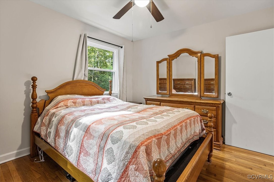 6314 Heritage Road Prince George, VA 23875 - Photo 16 of 26 Bedroom featuring wood-type flooring and ceiling f