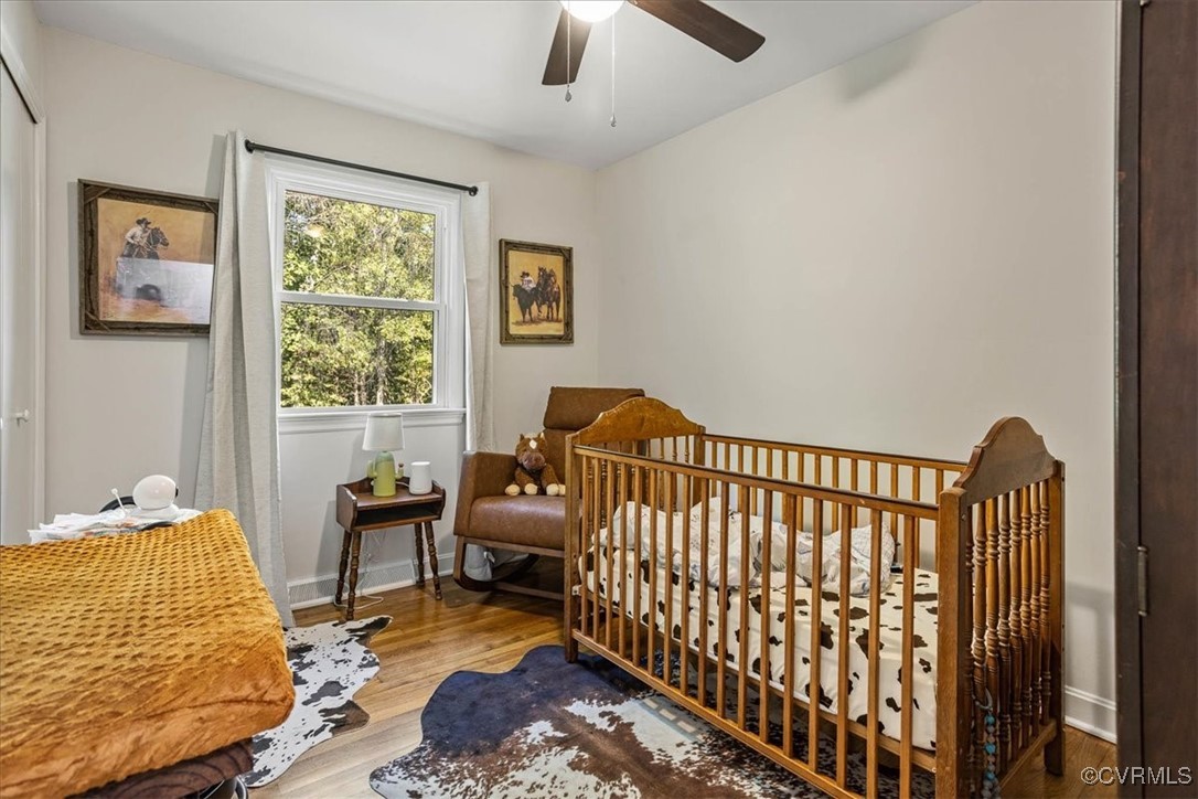 6314 Heritage Road Prince George, VA 23875 - Photo 20 of 26 Bedroom with a nursery area, wood-type flooring, a