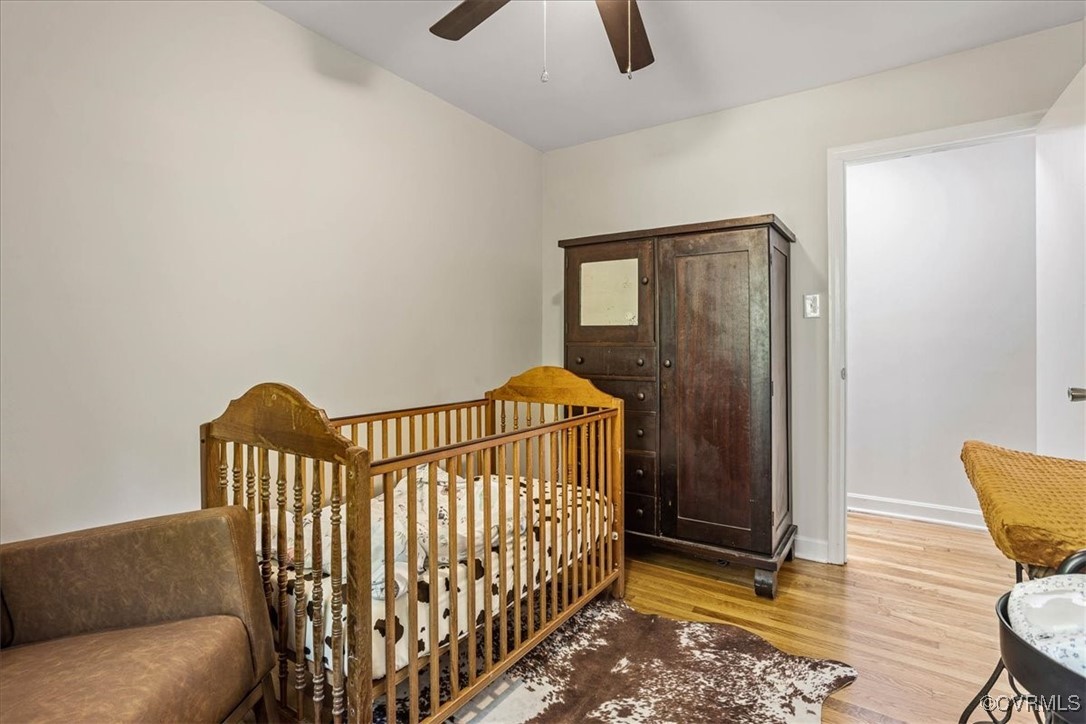 6314 Heritage Road Prince George, VA 23875 - Photo 21 of 26 Bedroom featuring light wood-type flooring, a nurs