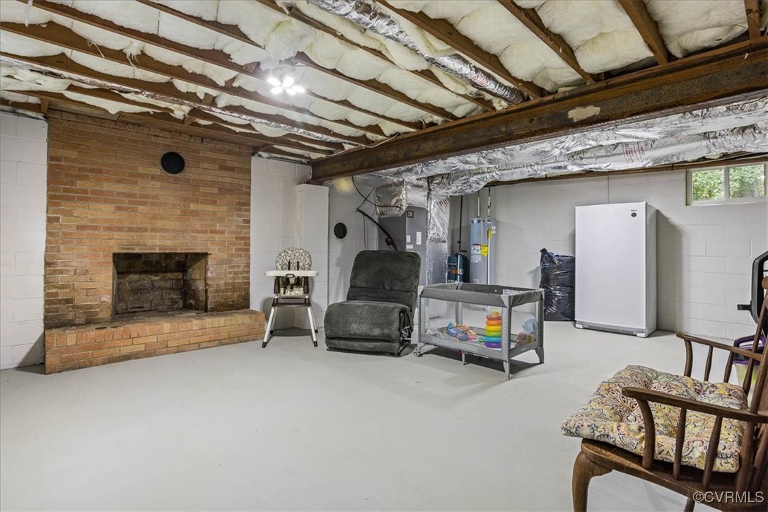 6314 Heritage Road Prince George, VA 23875 - Photo 23 of 26 Basement with water heater, white fridge, and a br