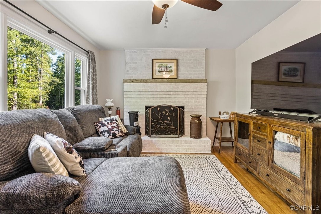 6314 Heritage Road Prince George, VA 23875 - Photo 6 of 26 Living room featuring a fireplace, light hardwood
