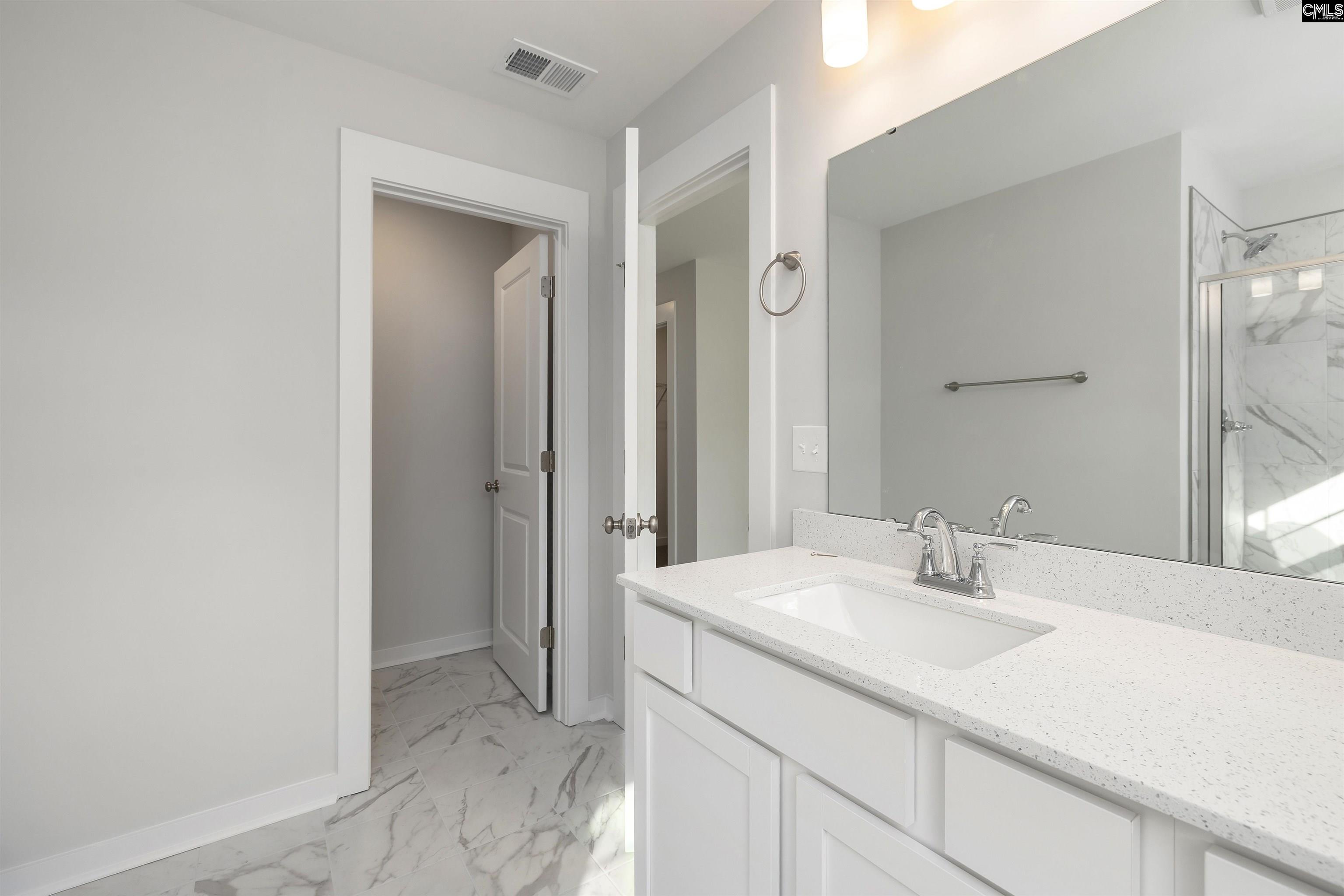 32 Fawn Spot Court Elgin, SC 29045 - Photo 21 of 28 a bathroom with a sink and a mirror