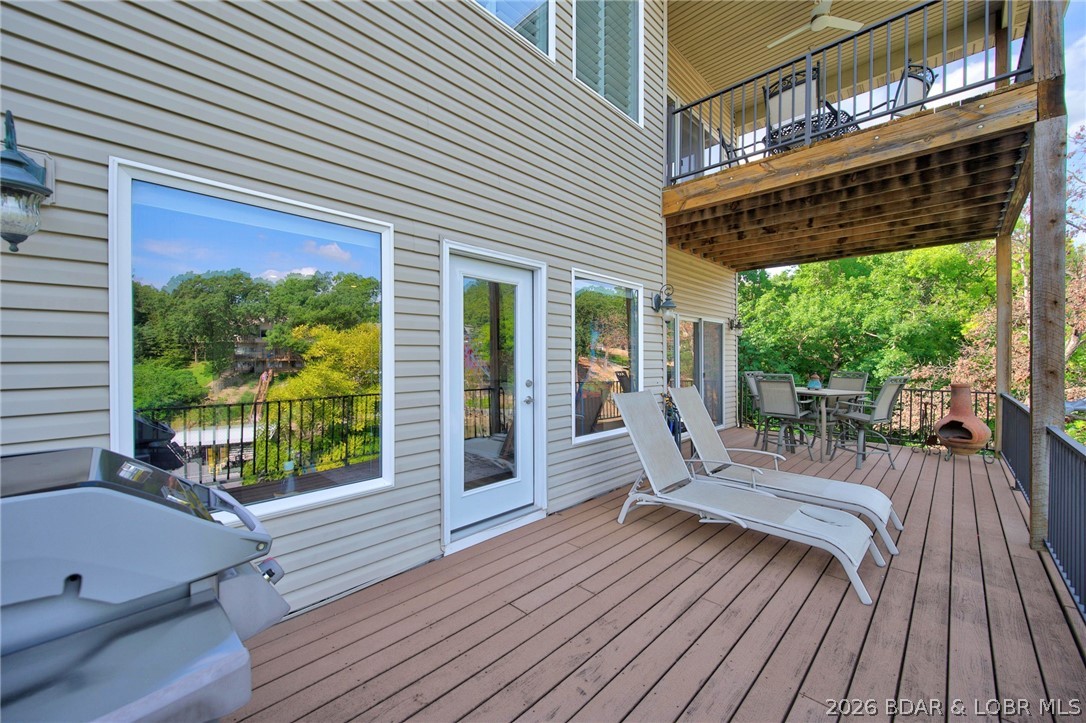 51 Arrowhead Beach Road Lake Ozark, MO 65049 - Photo 49 of 68 lowere level deck lots of room for guests to relax