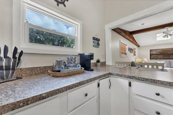 a kitchen with sink and window