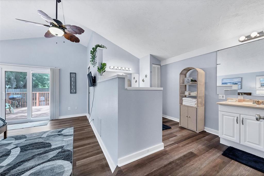 900 Beverly Avenue Northwest Largo, FL 33770 - Photo 18 of 32 a view of a livingroom with wooden floor and a ceiling fan