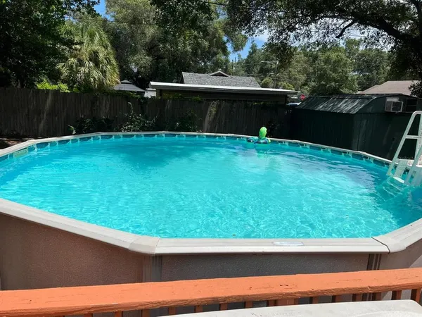 a view of house with a yard