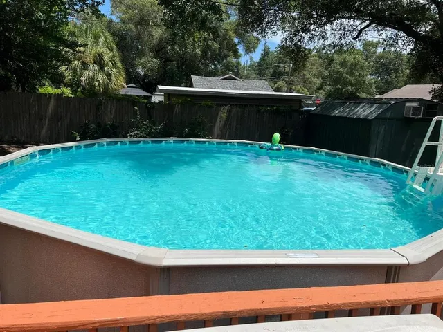 a view of house with a yard