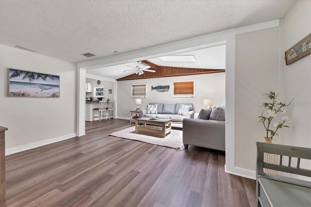 900 Beverly Avenue Northwest Largo, FL 33770 - Photo 3 of 32 a living room with furniture and a wooden floor