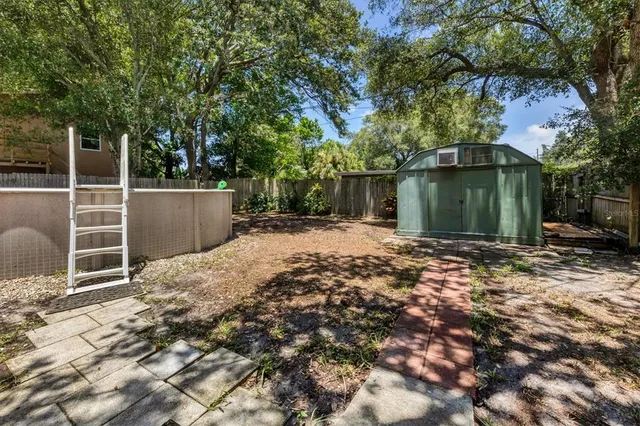 a backyard of a house with lots of green space