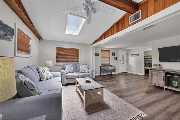 a living room with fireplace furniture and a flat screen tv