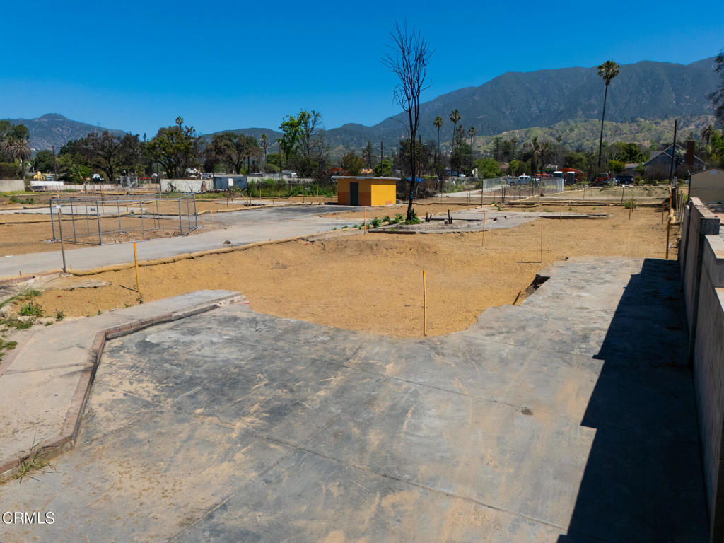 351 West Harriet Street Altadena, CA 91001 - Photo 13 of 14 a view of a swimming pool with a table and chairs