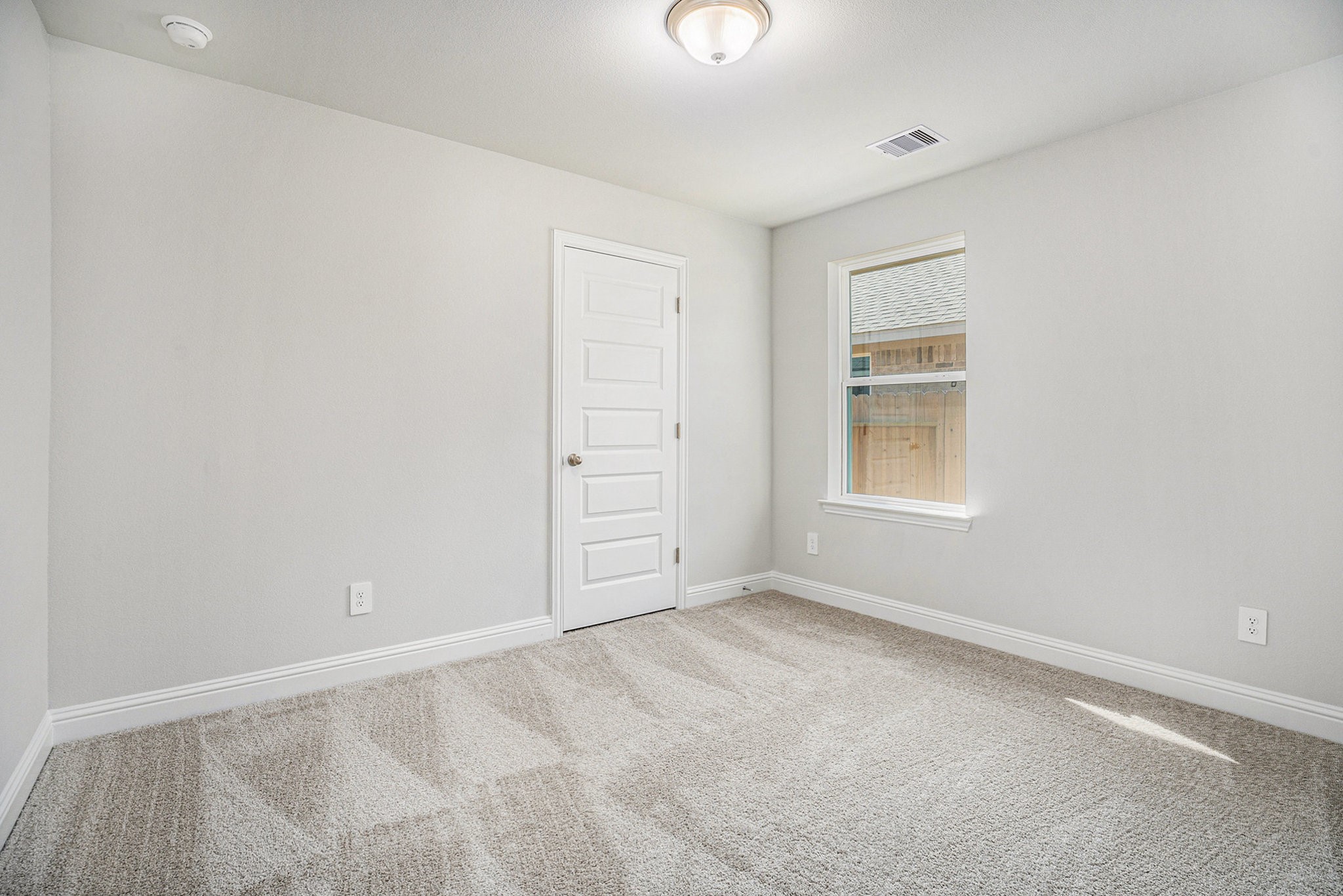 408 Bryan Street Angleton, TX 77515 - Photo 11 of 17 an empty room with windows