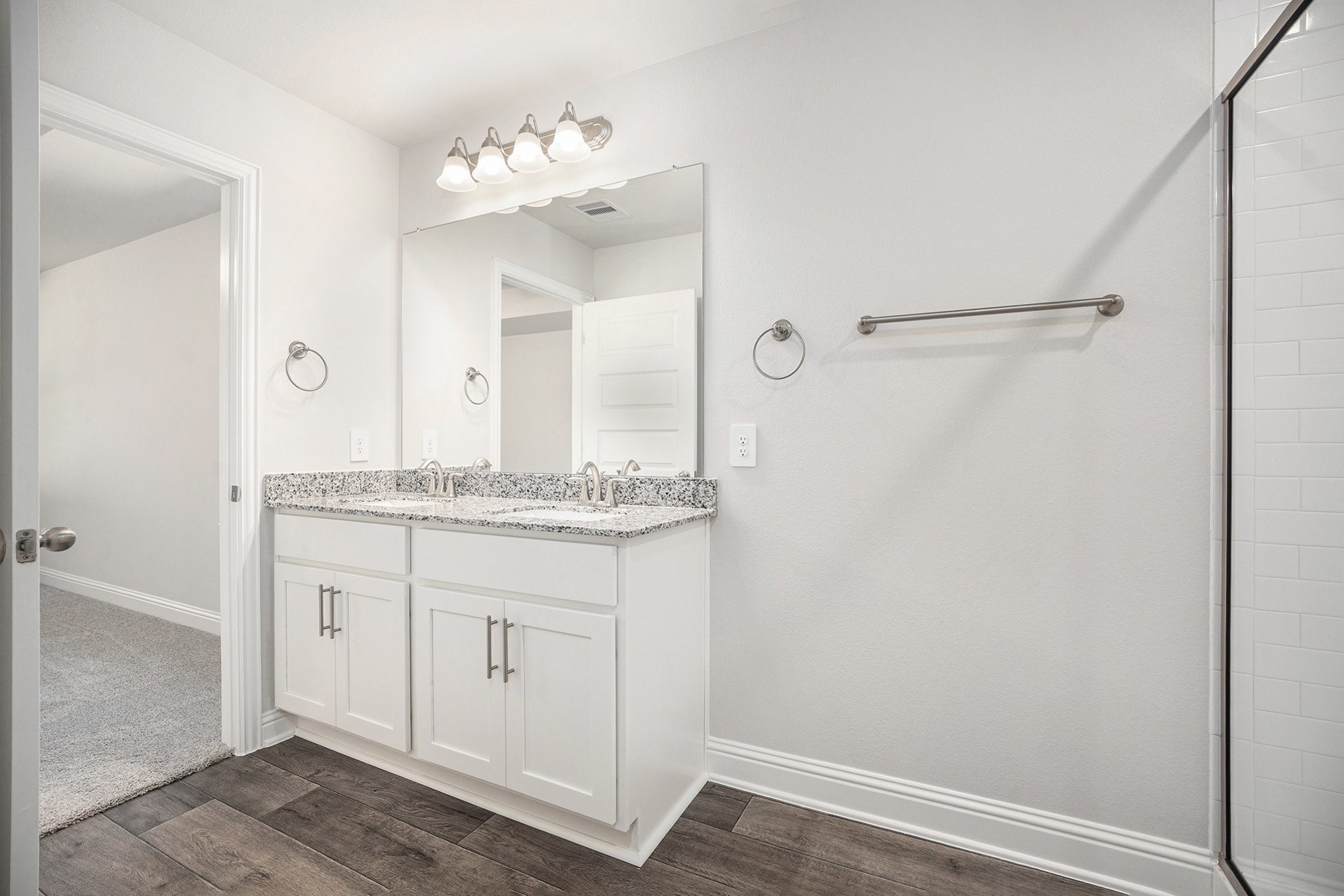 408 Bryan Street Angleton, TX 77515 - Photo 15 of 17 a bathroom with a granite countertop sink and a mirror