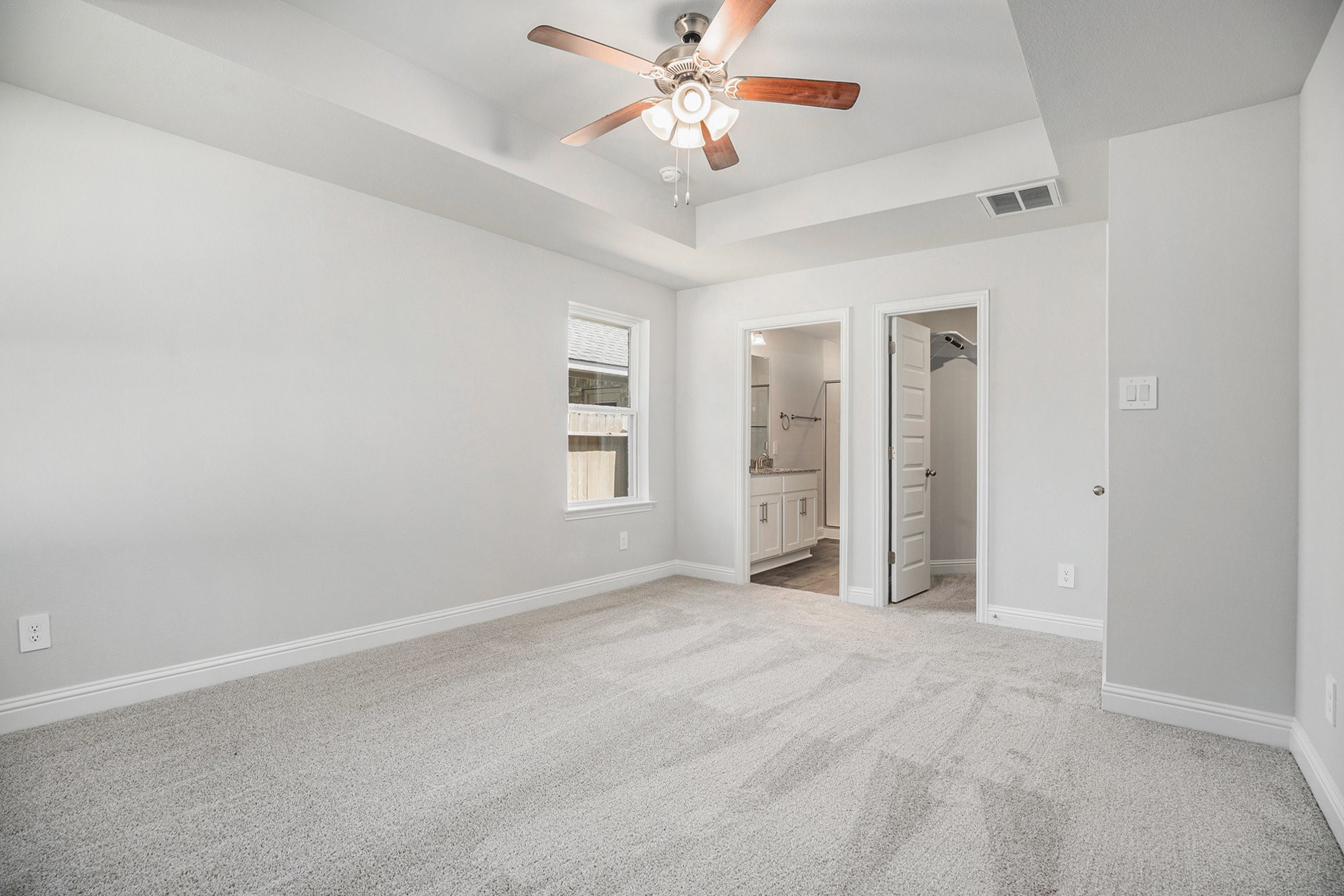 408 Bryan Street Angleton, TX 77515 - Photo 9 of 17 an empty room with windows and ceiling fan