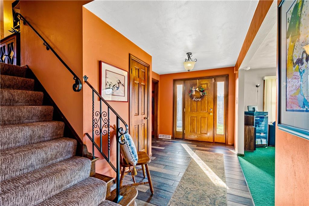 279 Hamtom Road Eighty Four, PA 15330 - Photo 12 of 25 a view of an entryway with wooden floor door windows and a livingroom
