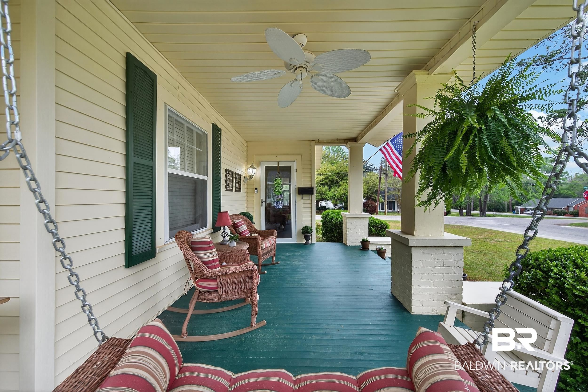 79 Mims Street Monroeville, AL 36460 - Photo 5 of 27 Wooden porch with ceiling fan