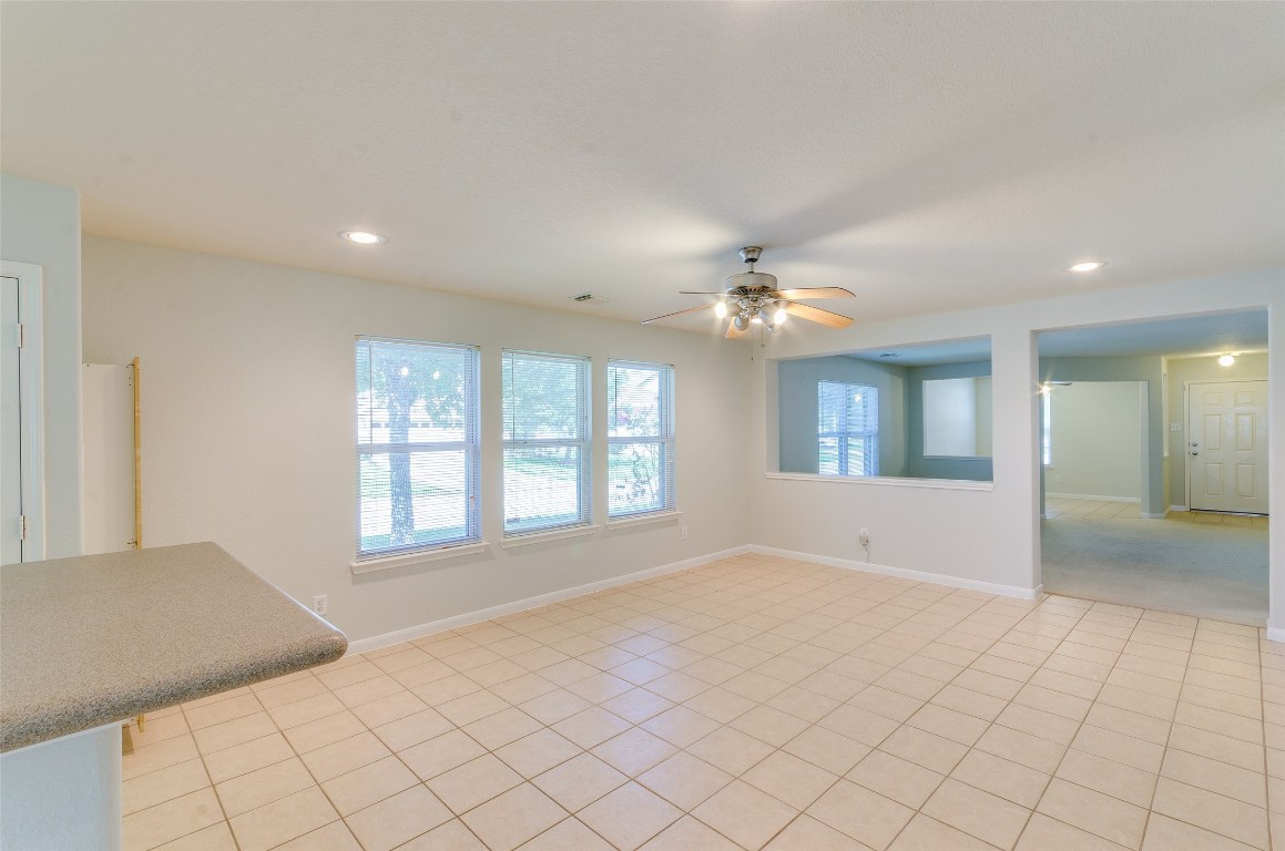 3302 Legends Landing Drive Spring, TX 77386 - Photo 17 of 48 a view of an empty room with window and chandelier fan