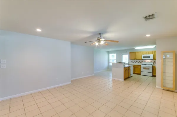a view of kitchen with sink and window