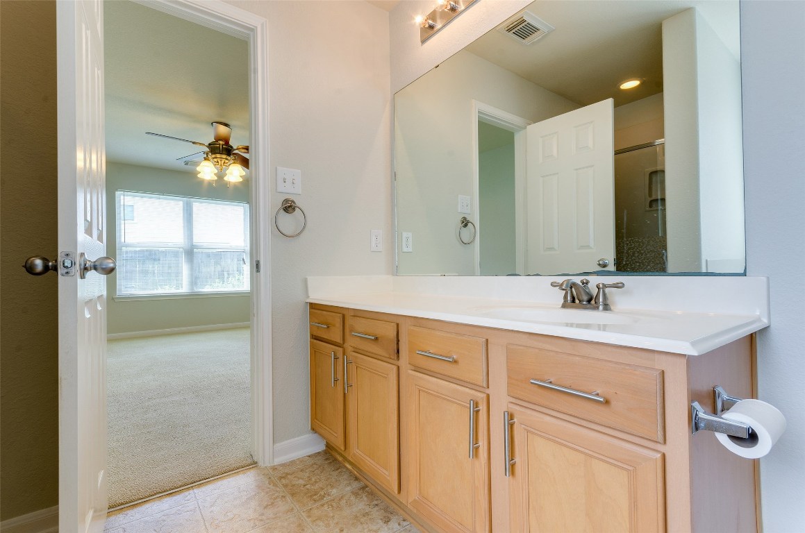 3302 Legends Landing Drive Spring, TX 77386 - Photo 36 of 48 a bathroom with a granite countertop sink a mirror and a shower