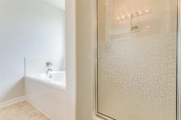 a bathroom with a shower and a sink