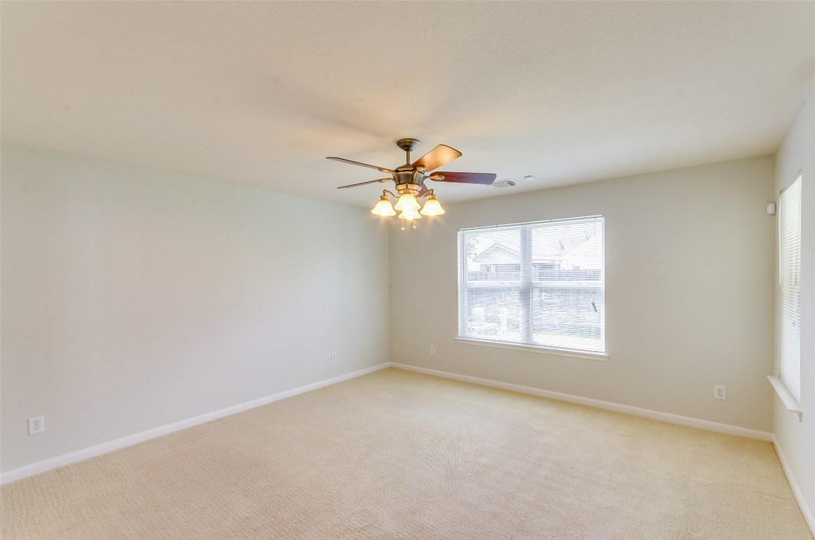 3302 Legends Landing Drive Spring, TX 77386 - Photo 40 of 48 an empty room with windows and fan