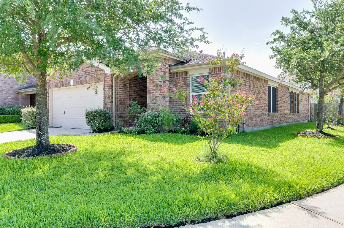 3302 Legends Landing Drive Spring, TX 77386 - Photo 7 of 48 a front view of a house with garden