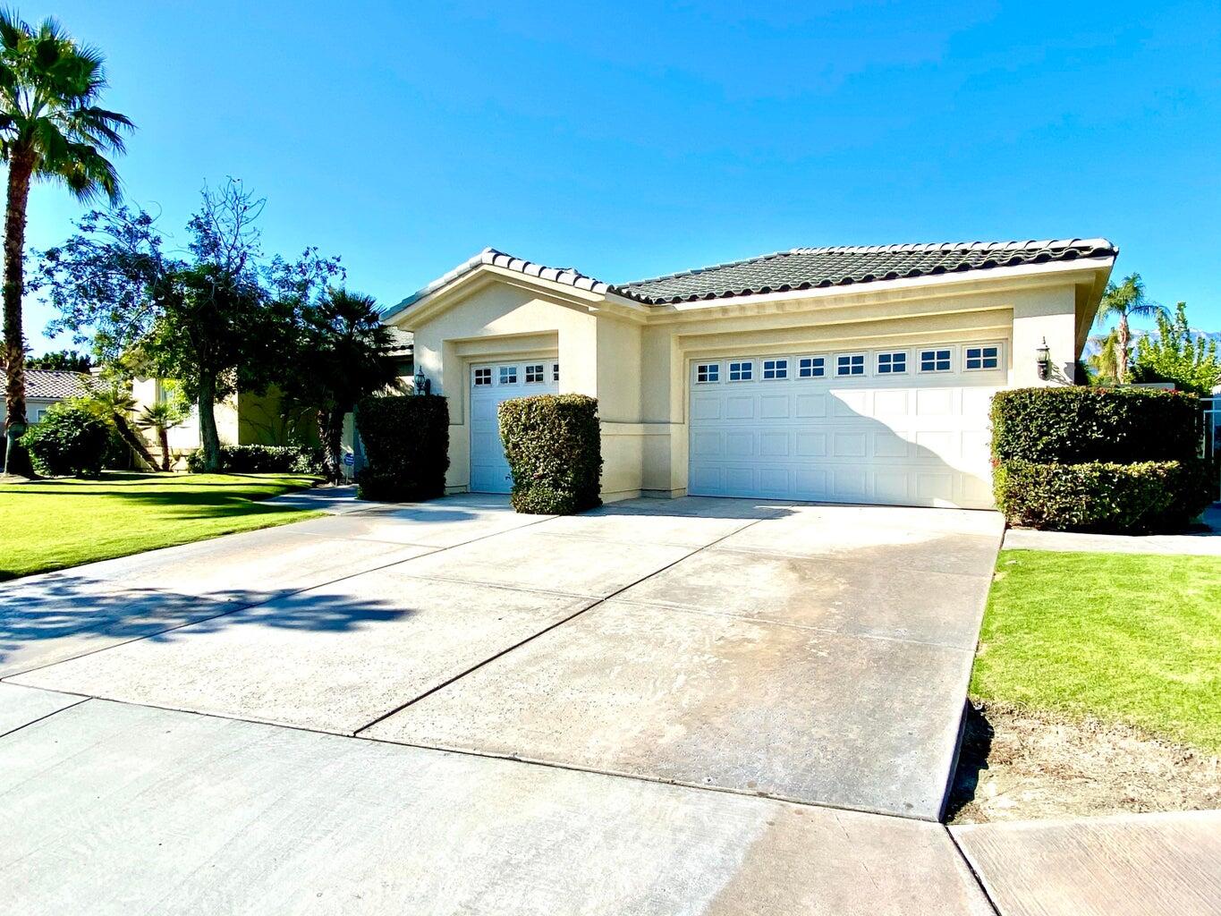 5 Victoria Falls Drive Rancho Mirage, CA 92270 - Photo 12 of 26 a front view of a house with a yard