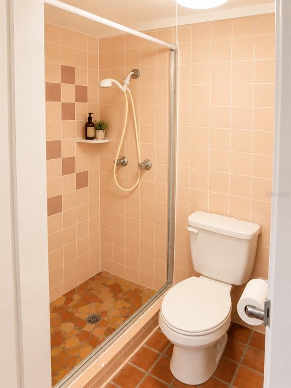 1559 Barry Road Clearwater, FL 33756 - Photo 17 of 20 a bathroom with a toilet and a shower