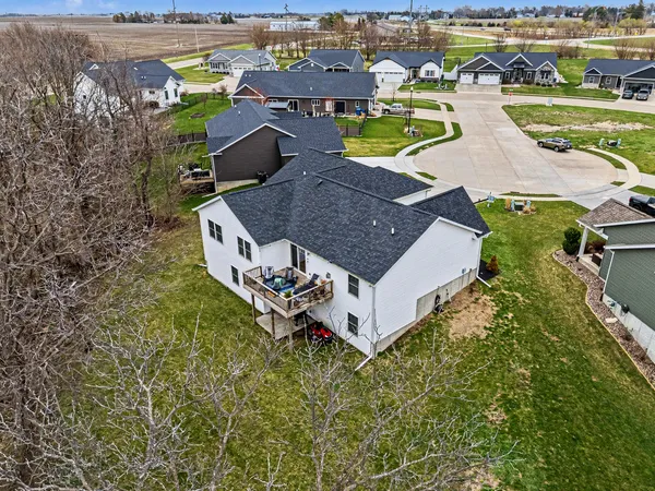 an aerial view of a house with a ocean view