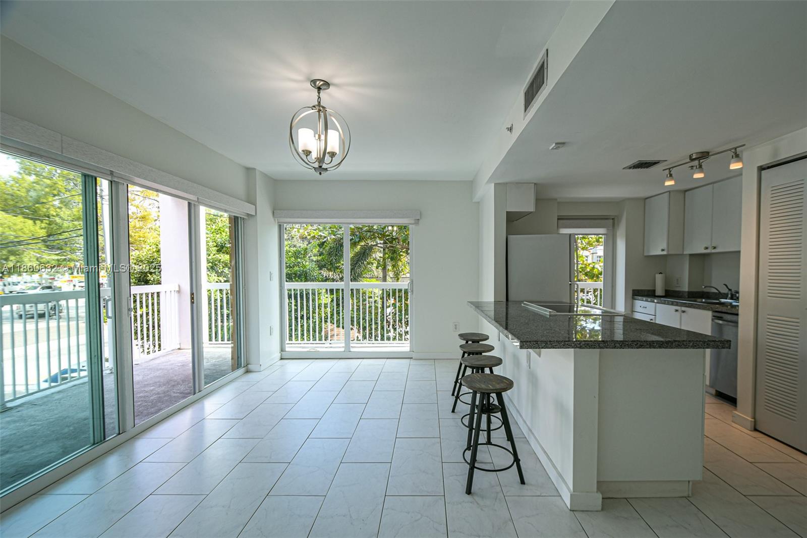 2740 Southwest 28th Terrace, Unit 201 Miami, FL 33133 - Photo 4 of 15 a view of a dining room with furniture window and outside view