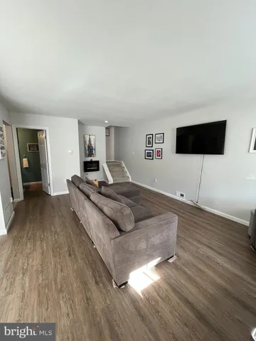 a spacious bedroom with a bed and a flat screen tv