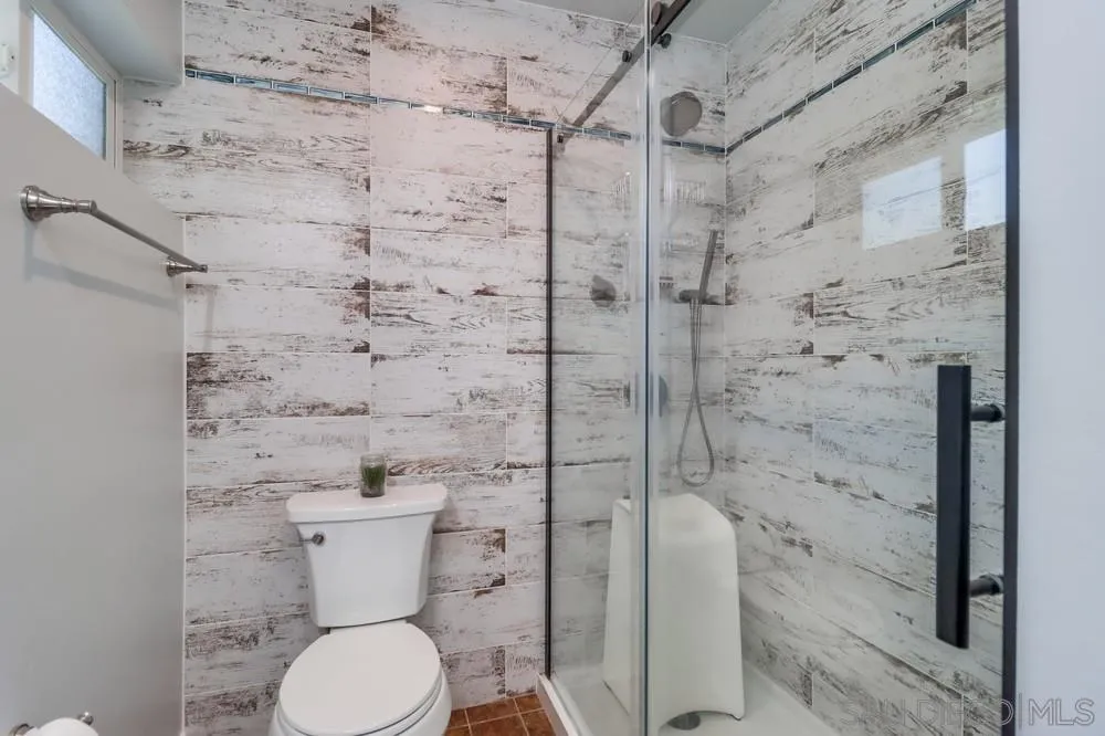 12718 Willow Road Lakeside, CA 92040 - Photo 14 of 46 a white toilet sitting next to a shower