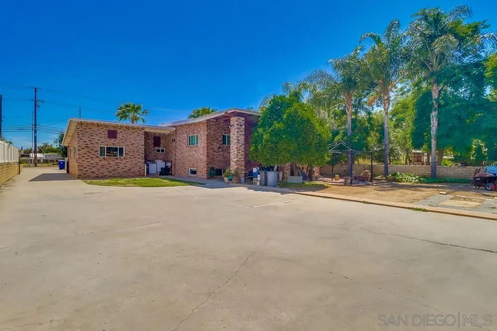 12718 Willow Road Lakeside, CA 92040 - Photo 22 of 46 a large house with a large tree in front of it