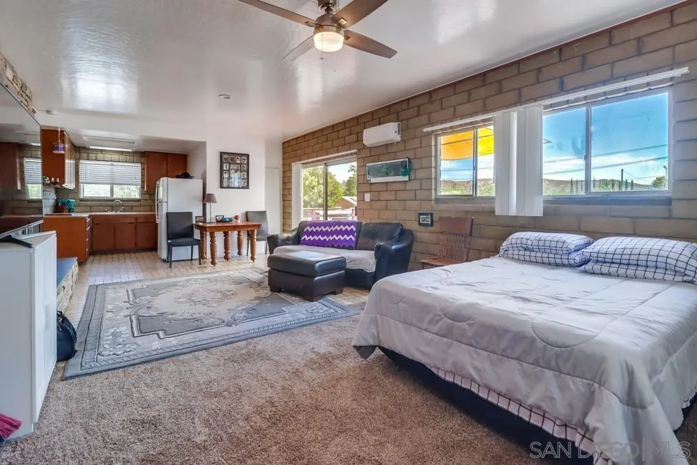 12718 Willow Road Lakeside, CA 92040 - Photo 29 of 46 a spacious bedroom with two beds and a window