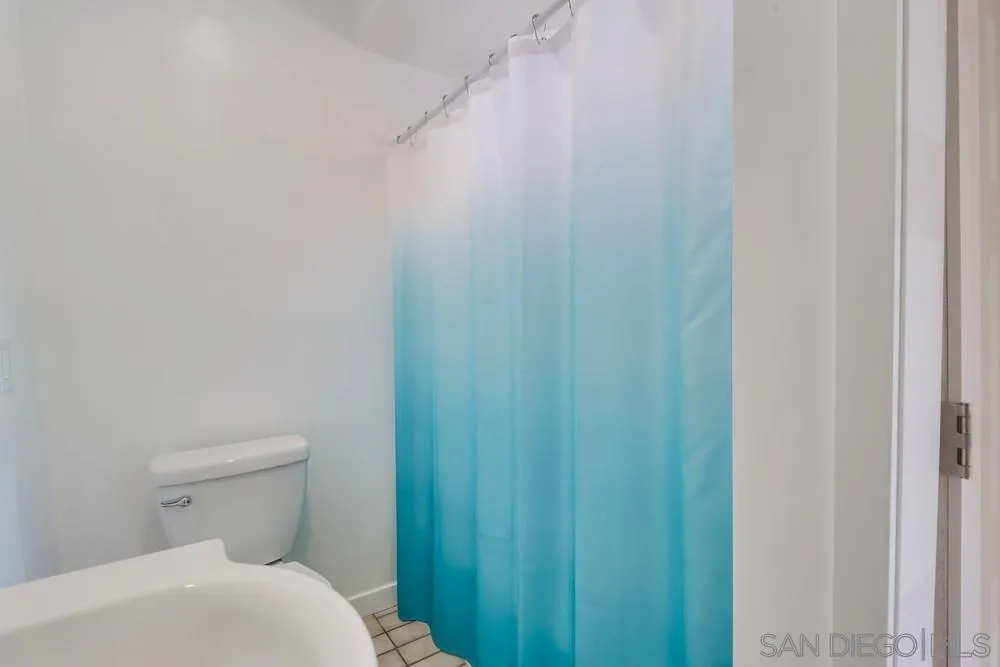 12718 Willow Road Lakeside, CA 92040 - Photo 30 of 46 a bathroom with a toilet and a shower