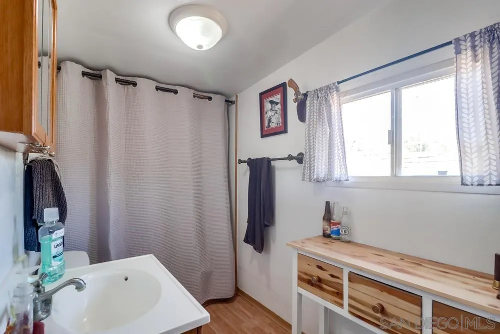 12718 Willow Road Lakeside, CA 92040 - Photo 35 of 46 a bathroom with a sink and a mirror