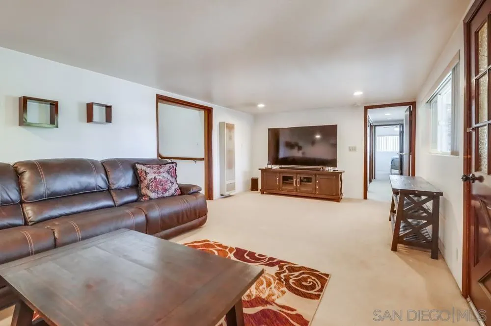 12718 Willow Road Lakeside, CA 92040 - Photo 4 of 46 a living room with furniture and a flat screen tv