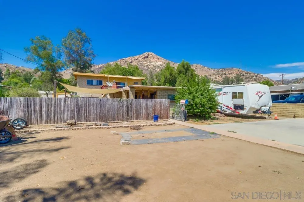 12718 Willow Road Lakeside, CA 92040 - Photo 41 of 46 a backyard of a house with table and chairs