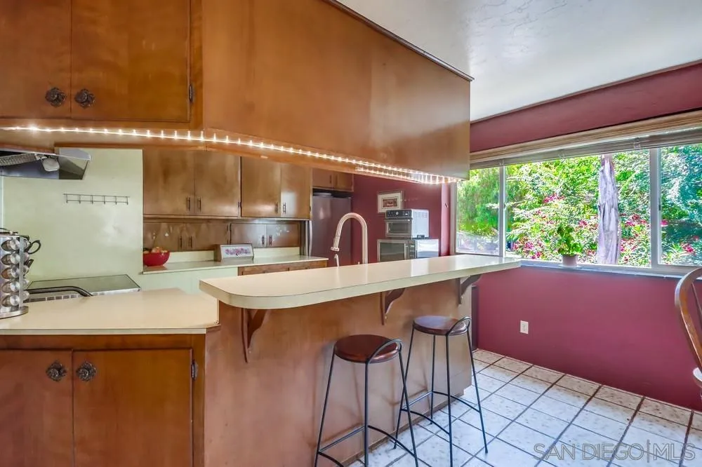 12718 Willow Road Lakeside, CA 92040 - Photo 8 of 46 a kitchen with a sink and a large window