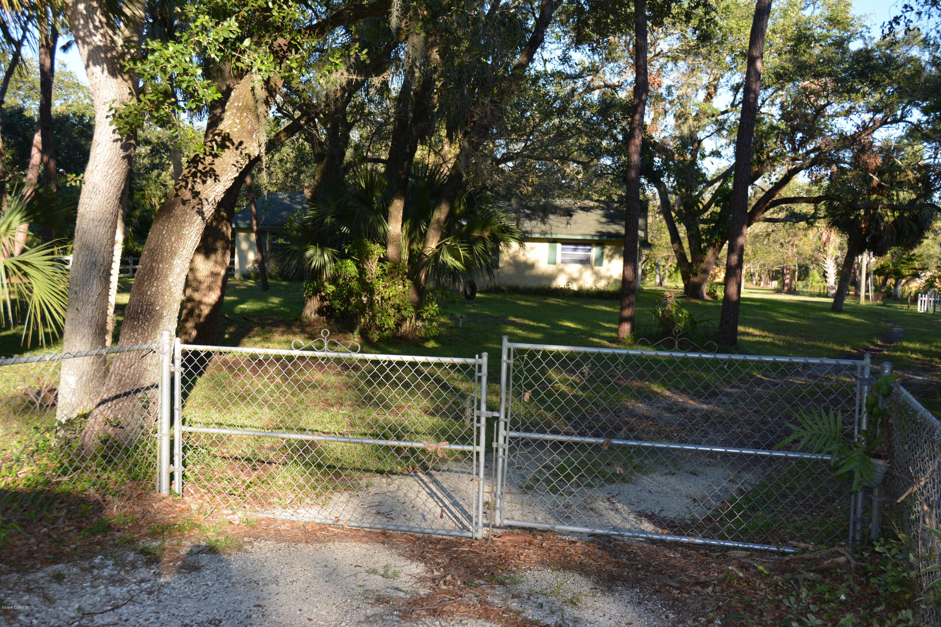 1615 Harlock Road Melbourne, FL 32934 - Photo 48 of 50 Yard - Gated driveway entrance