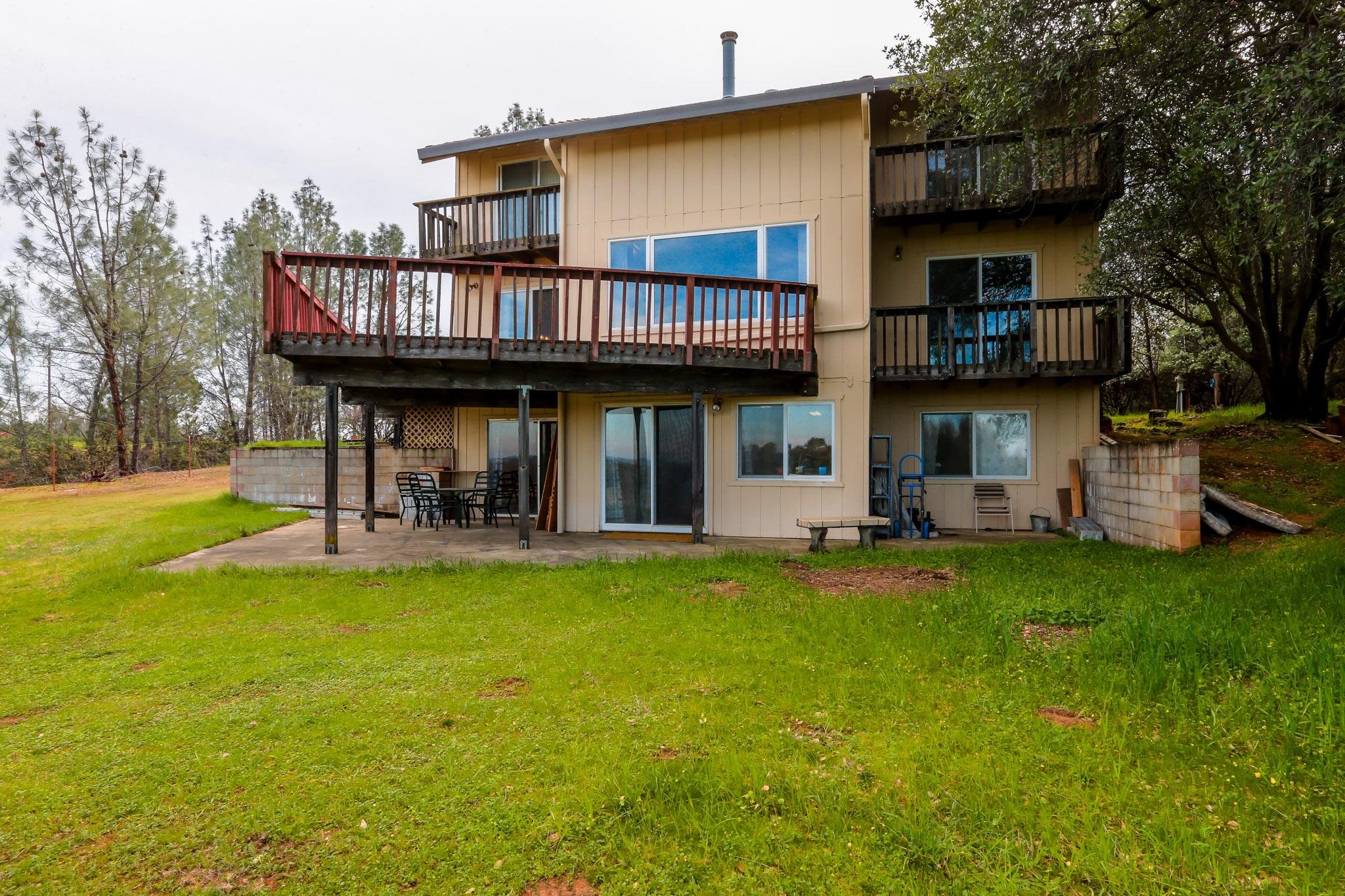 19980 Live Oak Road Red Bluff, CA 96080 - Photo 3 of 36 a view of a house with swimming pool and porch
