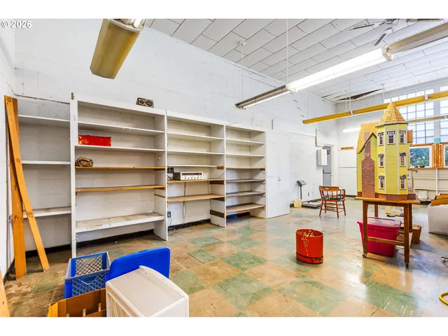 a living room with furniture and a pool table