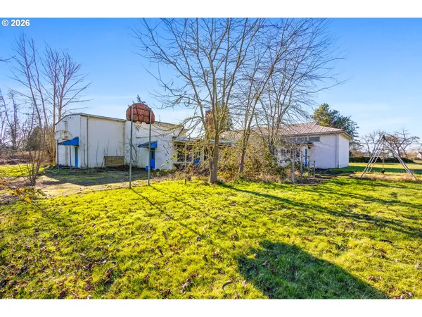 a view of a house with a big yard