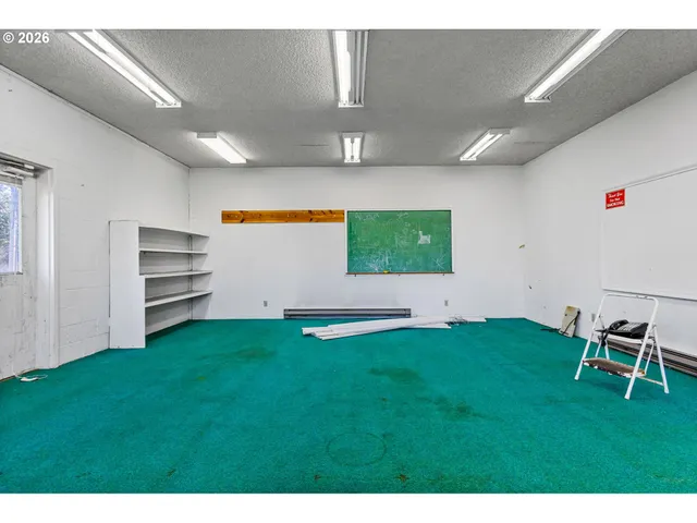 a view of a room with gym equipment and garden