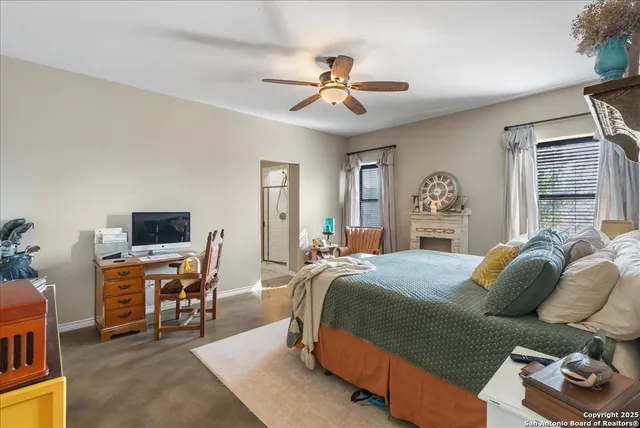 a bedroom with a bed and a desk